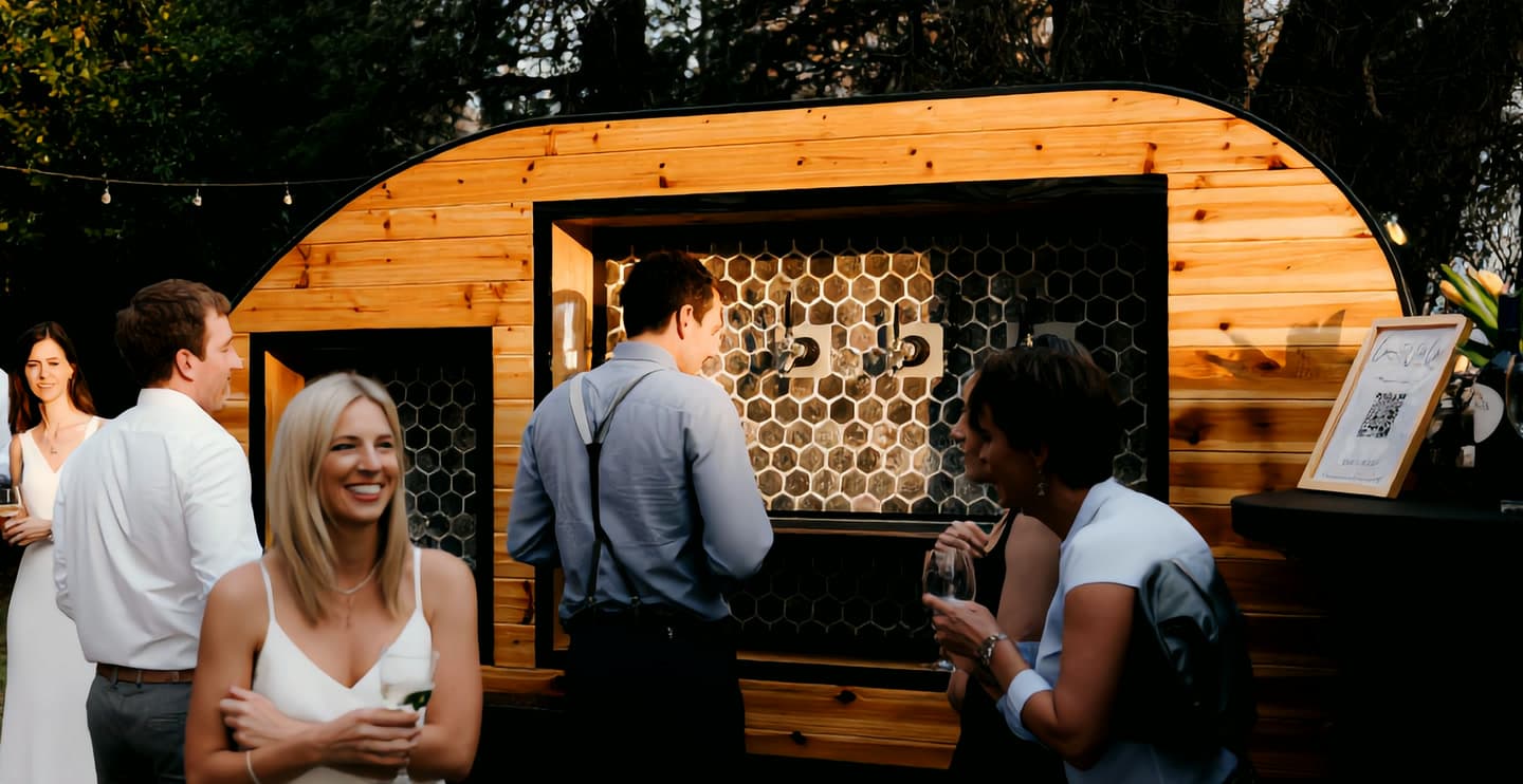 The Tap Wagon serving guests at an evening event